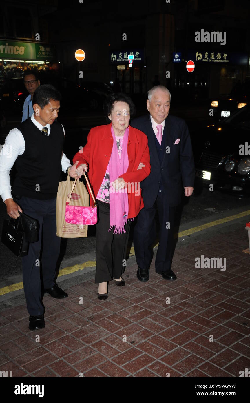 --FILE--Hui Sai Fun, right, Chairman of Central Development Limited, and his wife are pictured in front of a restaurant in Hong Kong, China, 1 Februar Stock Photo