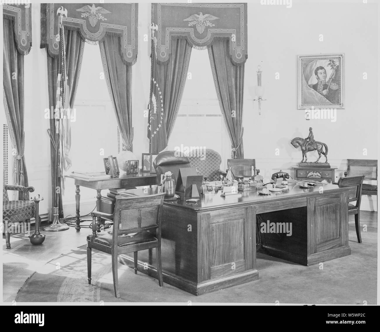 Photograph of the President's desk and other furnishings in the Oval