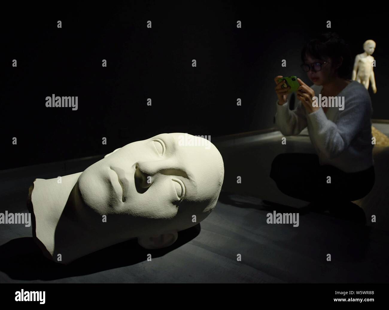 A wood artwork created by Italian wood sculptor Bruno Walpoth is on