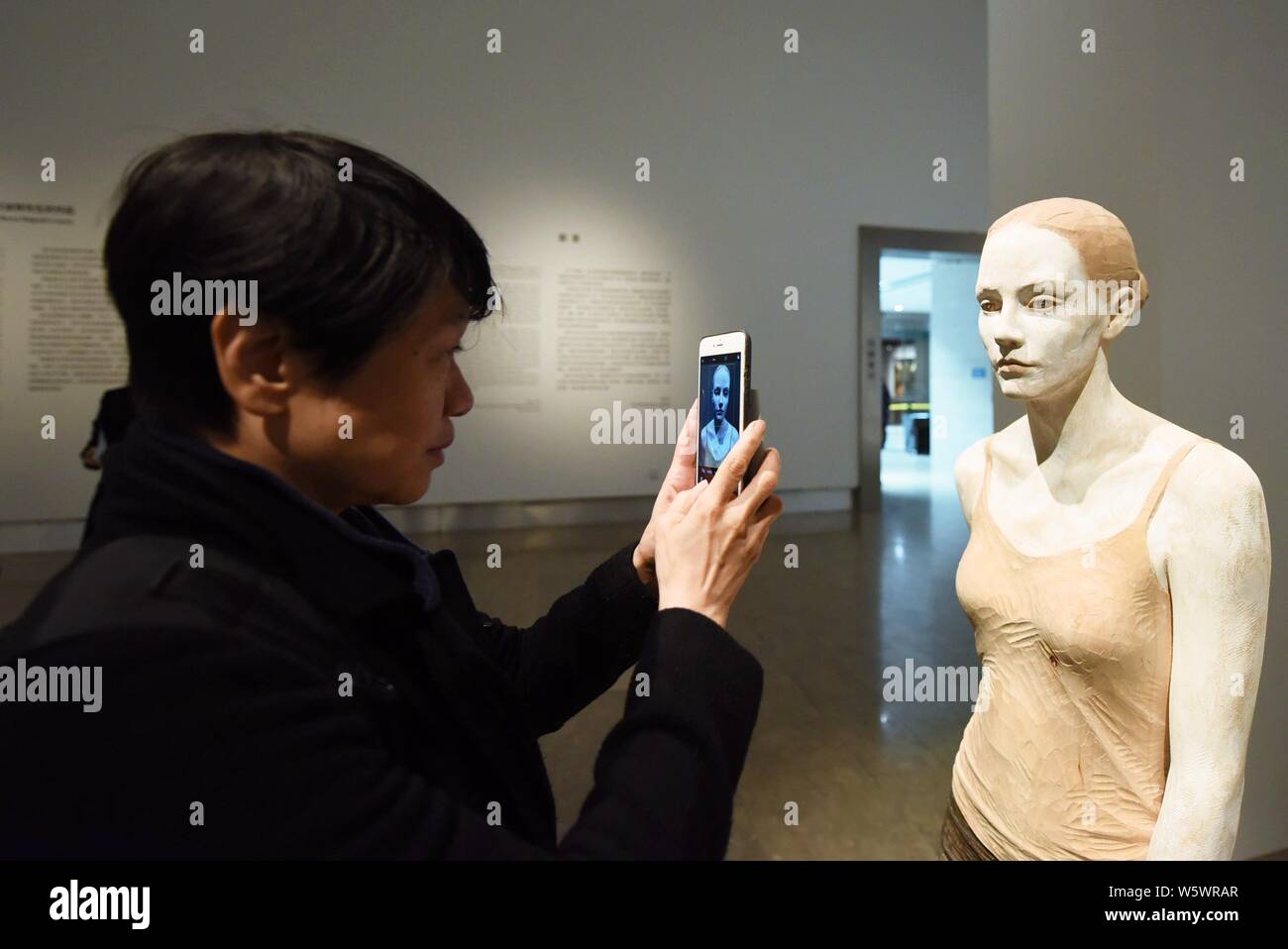 A wood artwork created by Italian wood sculptor Bruno Walpoth is on