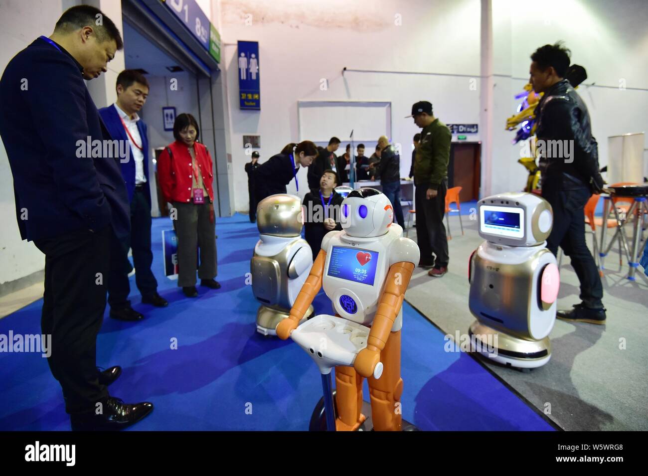 Robots are on display during the 5th China Yiwu International Manufacturing Equipment Expo in Yiwu city, Jinhua city, east China's Zhejiang province, Stock Photo