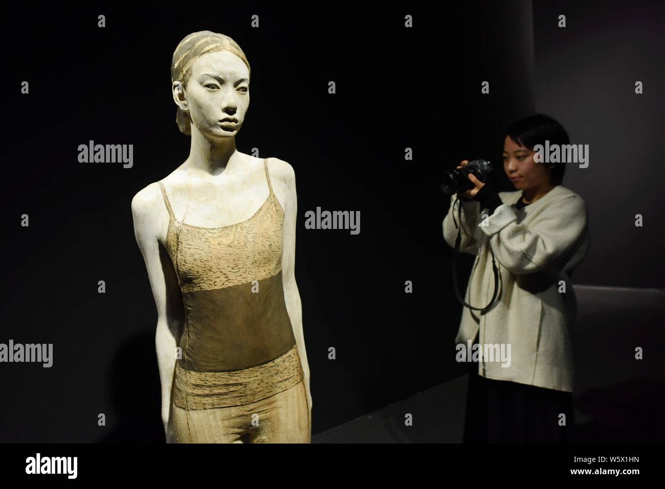 A wood artwork created by Italian wood sculptor Bruno Walpoth is on