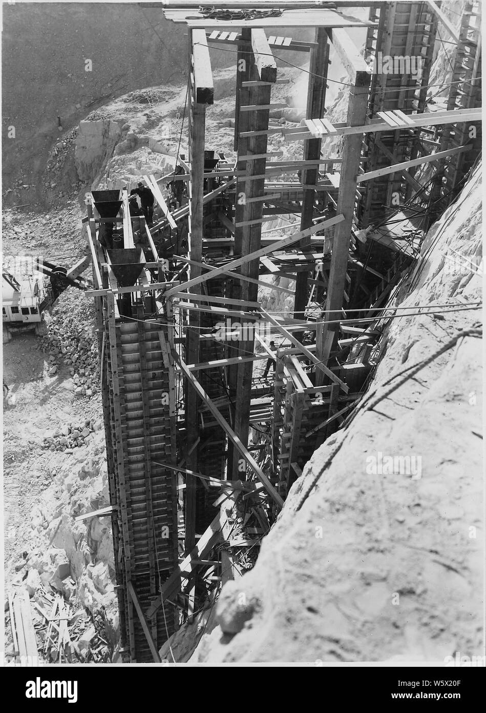 Pouring concrete column supports for the west mixing plant.; Scope and content:  Photograph from Volume Two of a series of photo albums documenting the construction of the Grand Coulee Dam and related work on the Columbia Basin Project. Stock Photo