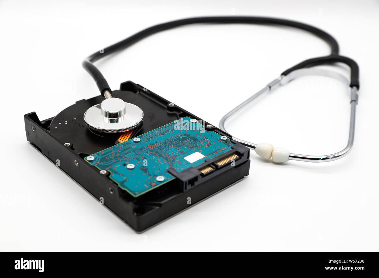 stethoscope with hard disk isolated and white background (this image for technology security checkup concept) Stock Photo