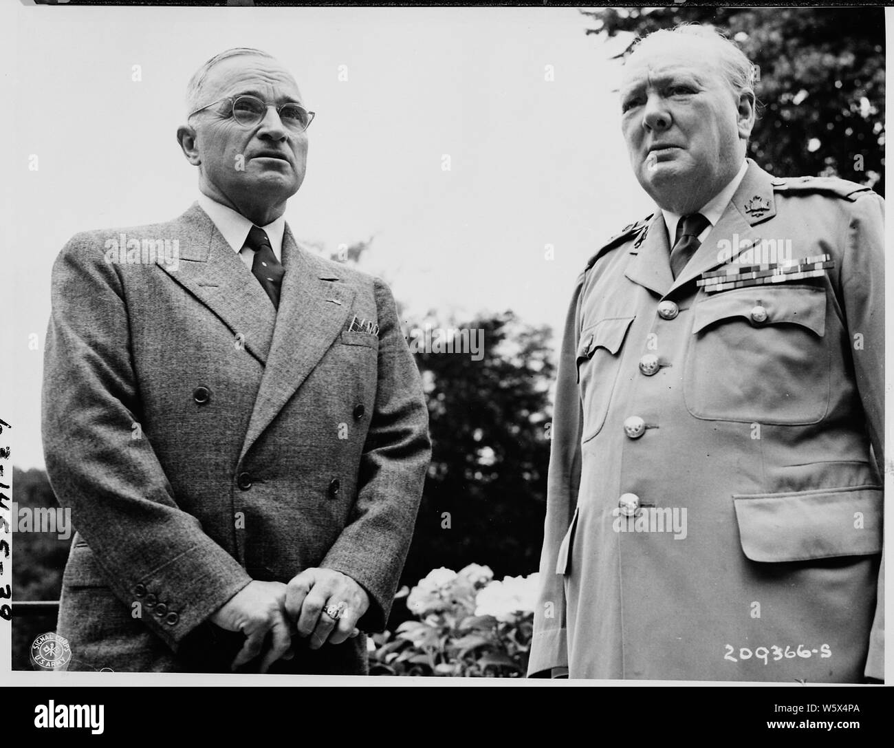 President Harry S. Truman poses with British Prime Minister Winston Churchill during their visit at the residence of Mr. Churchill during the Potsdam Conference in Germany. Stock Photo