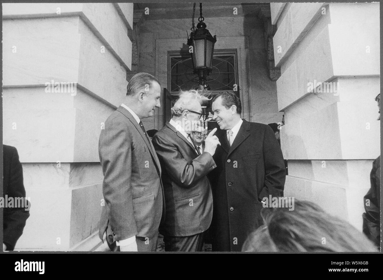 President Nixon conversing with Senator Dirksen and Vice President Agnew on the occassion of a luncheon with Senate members; Scope and content:  Pictured: Vice President Sprio Agnew, Senator Everett M. Dirksen -Illinios (R), President Richard M. Nixon. Subject: Staff with President- Group. Stock Photo