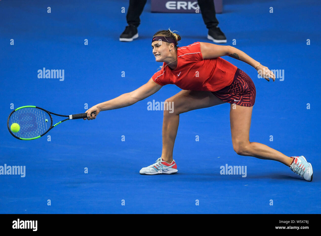Aryna Sabalenka of Belarus returns a shot to Caroline Garcia of France