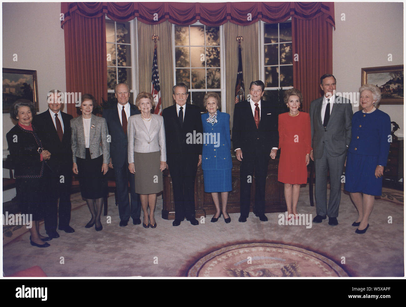 President and Mrs. Bush pose with the former presidents and first ladies in the replica of the Oval Office at the Dedication of the Ronald Reagan Presidential Library in Simi Valley, California. The participants include: Mrs. Lyndon Johnson, former President and Mrs. Jimmy Carter, former President and Mrs. Gerald Ford, , former President and Mrs. Nixon, and former President and Mrs. Reagan Stock Photo