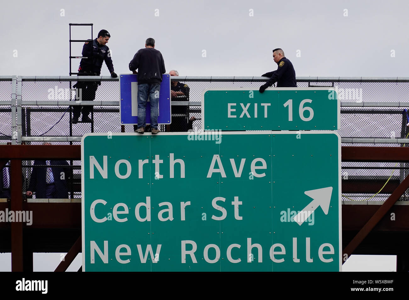 suicide jumper on bridge over interstate 95 in New Rochelle New York Stock Photo