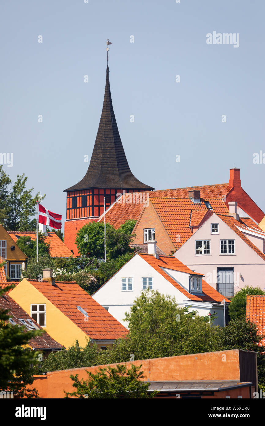 Svaneke Kirke and traditional red tiled houses, Svaneke, Bornholm Island, Baltic sea, Denmark, Europe Stock Photo