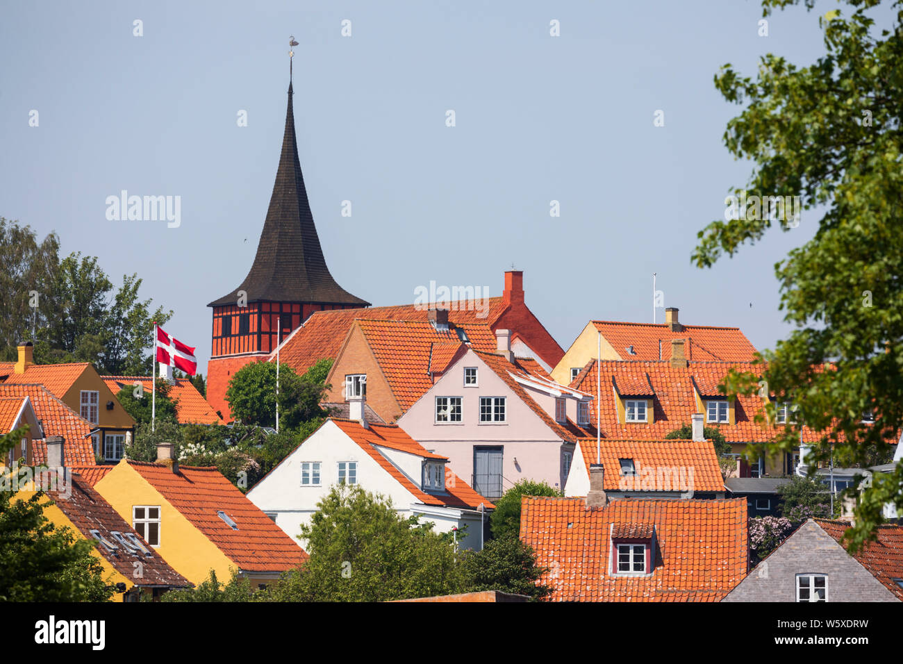 Svaneke Kirke and traditional red tiled houses, Svaneke, Bornholm Island, Baltic sea, Denmark, Europe Stock Photo