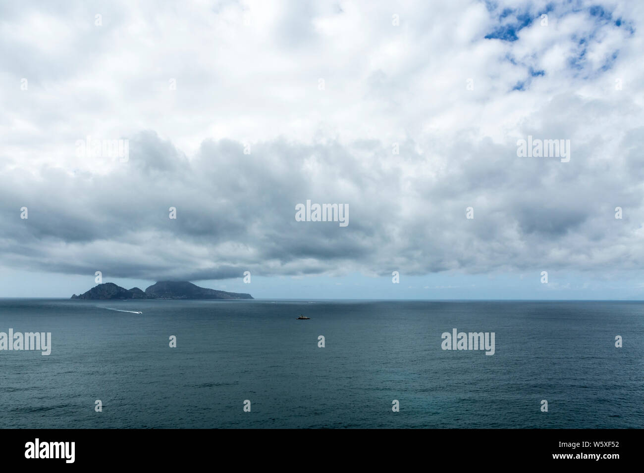 Dramatic clouds and sea views of Capri island from Sorrento, Naples, Italy Stock Photo