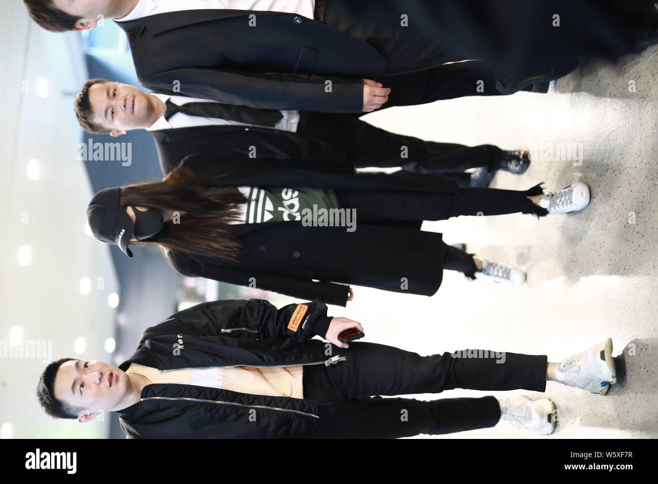 Hong Kong actress Angelababy arrives at an airport in Shanghai, China, 9 November  2018. Hat: Balenciaga Hoodie: adidas Shoes: Golden goose Trouse Stock Photo  - Alamy