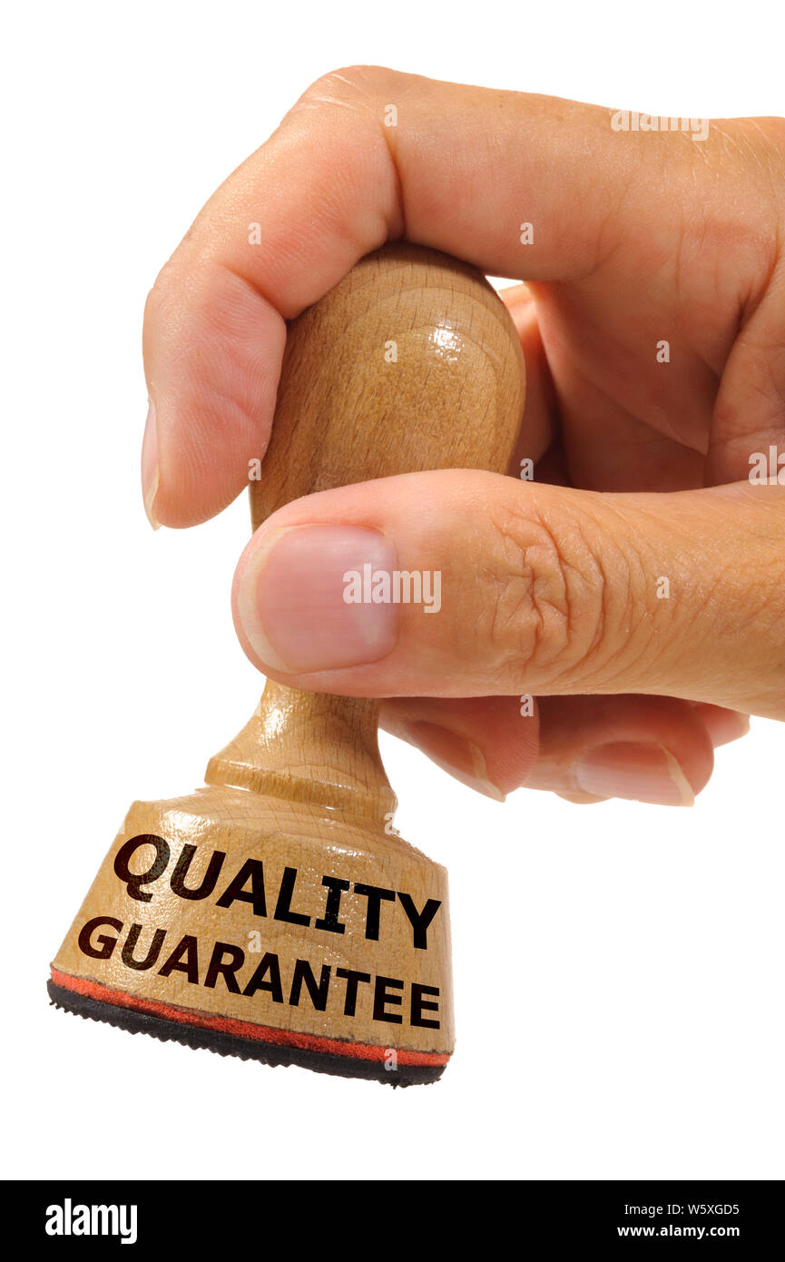 quality and guarantee  printed on rubber stamp Stock Photo