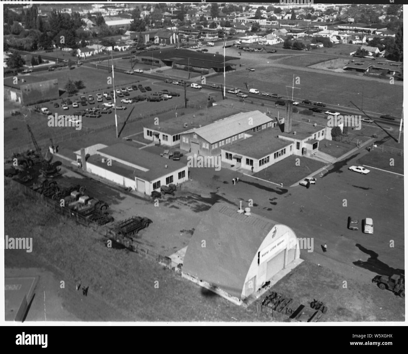 Result of arson at Naval Training Center. 1968. Eugene, Oregon.; Scope and content:  An air view of damage to parked vehicles. Stock Photo