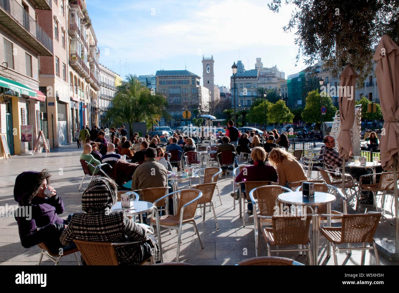 People in a terrace. Plaza de la Reina, Valencia, Spain. Stock Photo