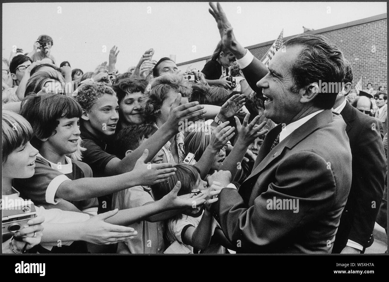 Richard M. Nixon being greeted by school children during a campaign stop.; Scope and content:  Pictured: Richard M. Nixon. Subject: Campaign - 1972. Stock Photo