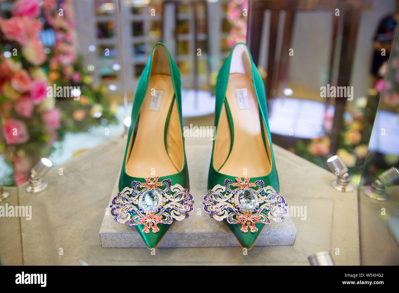 A pair of Jimmy Choo's luxury high heel shoes is on display during the First China International Import Expo (CIIE) and the Hongqiao International Eco Stock Photo