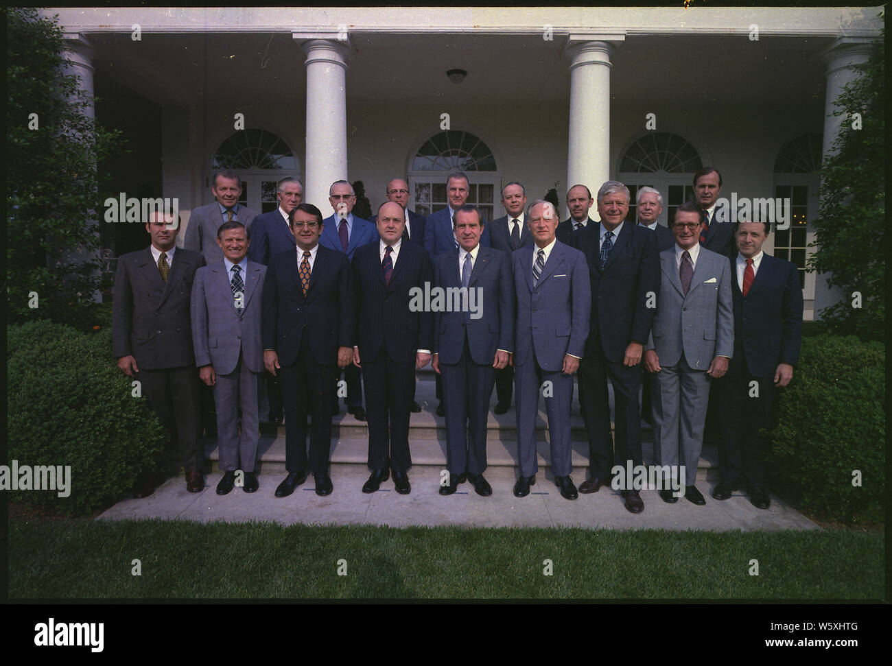Richard M. Nixon posing with his Cabinet; Scope and content:  Pictured: Front Row: Donald Rumsfeld, Sec. of Trasportation John Volpe, Sec. of Commerce Peter Peterson, Sec. of Defense Melvin Laird, Richard M. Nixon, Sec. of State William Rogers, Sec. of the Interior Rogers C.B. Morton, Sec. of HEW Elliot Richardson, Director of OMB Caspar Weinberger Back Row: Robert Finch, Sec. of HUD George Romney, Sec. of Agriculture Earl Butz, Sec. of the Treasury George Shultz, Vice President Spiro Agnew, Attorney General Richard Kleindienst, Sec. of Labor James Hodgson, Ambassador at large David Kennedy, A Stock Photo