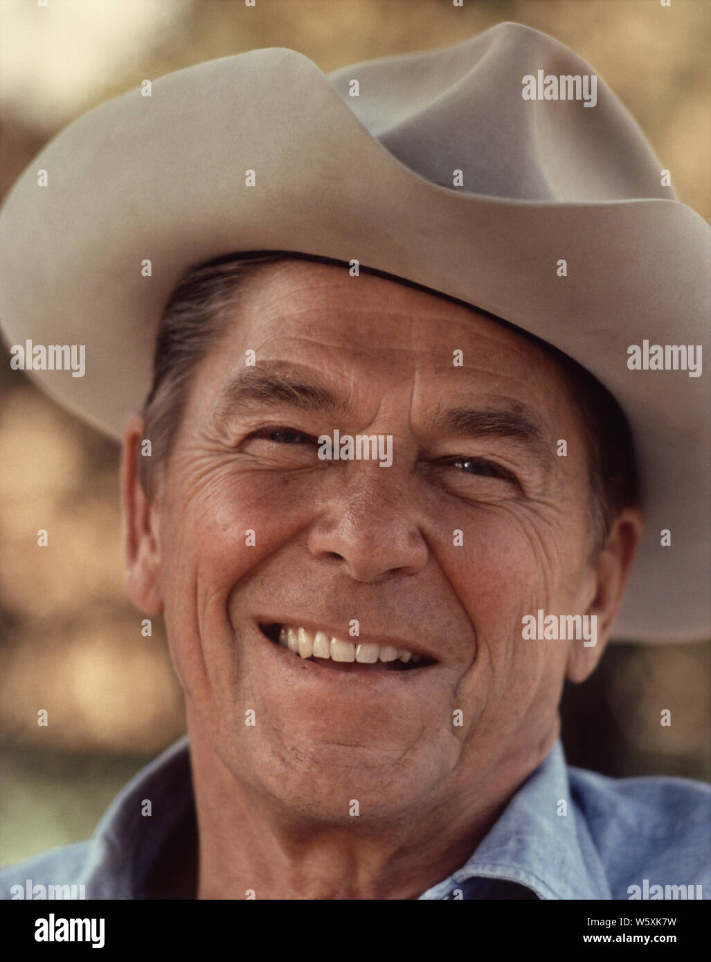 Photograph of Ronald Reagan in a cowboy hat at Rancho Del Cielo; English: Ronald Reagan wearing cowboy hat at Rancho del Cielo. Stock Photo