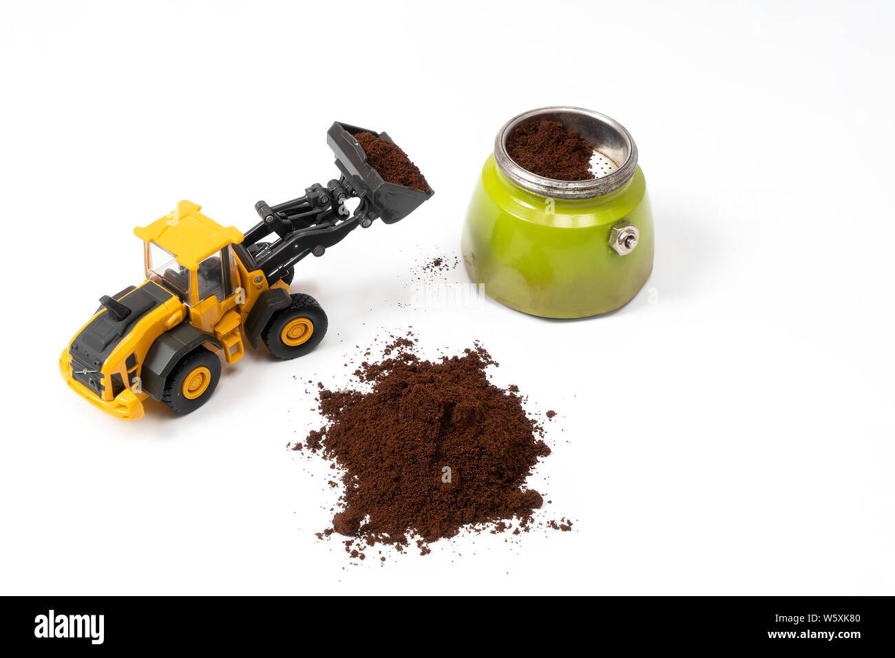 a bulldozer while loading coffee in the coffee maker Stock Photo