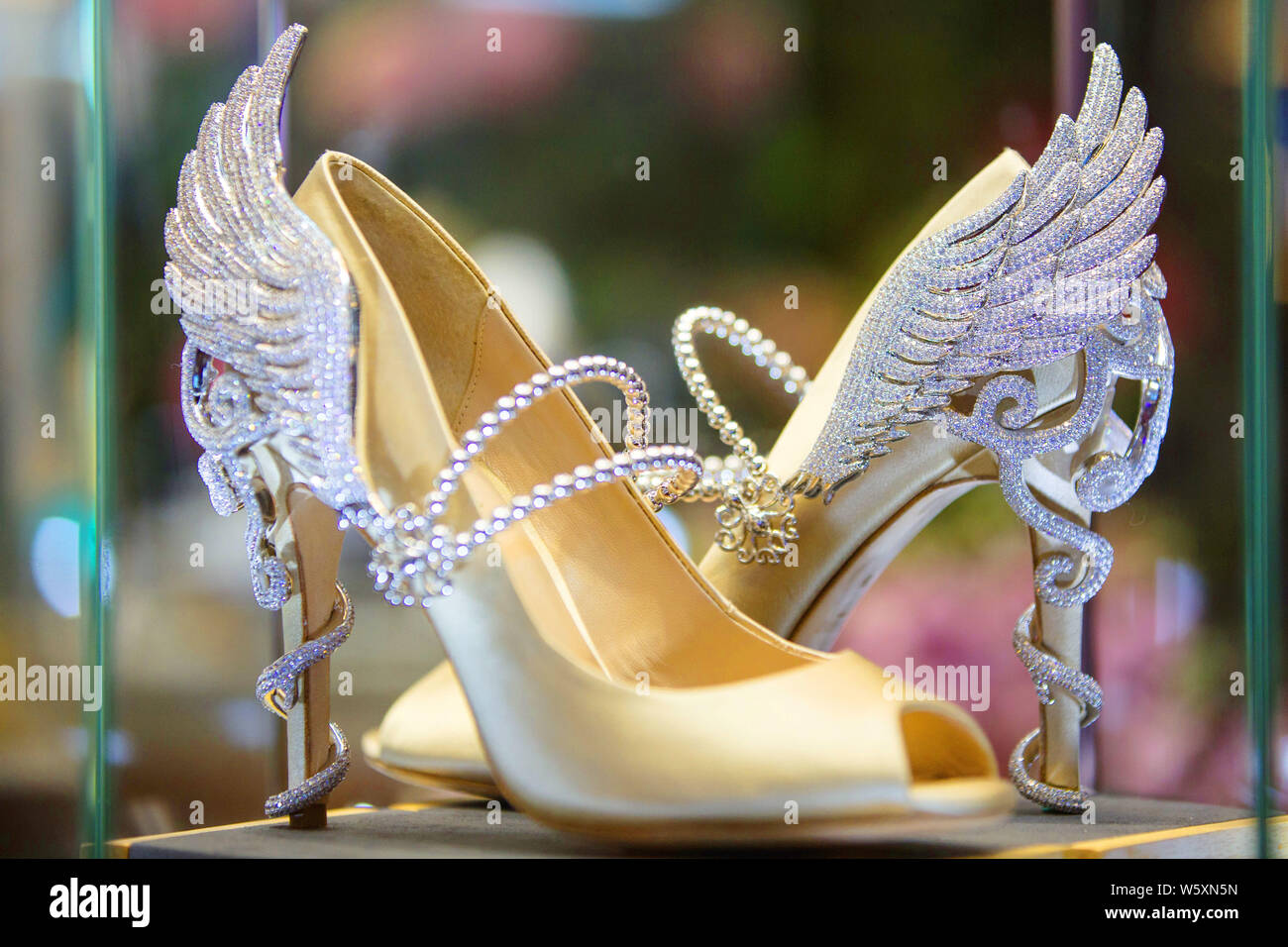 A pair of Jimmy Choo's luxury high heel shoes is on display during the First China International Import Expo (CIIE) and the Hongqiao International Eco Stock Photo