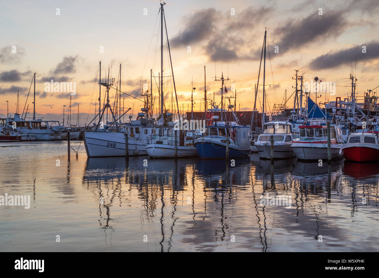 Fishing boats and yachts in the fishing harbour at sunrise, Gilleleje, Region Hovedstaden, Zealand, Denmark, Europe Stock Photo