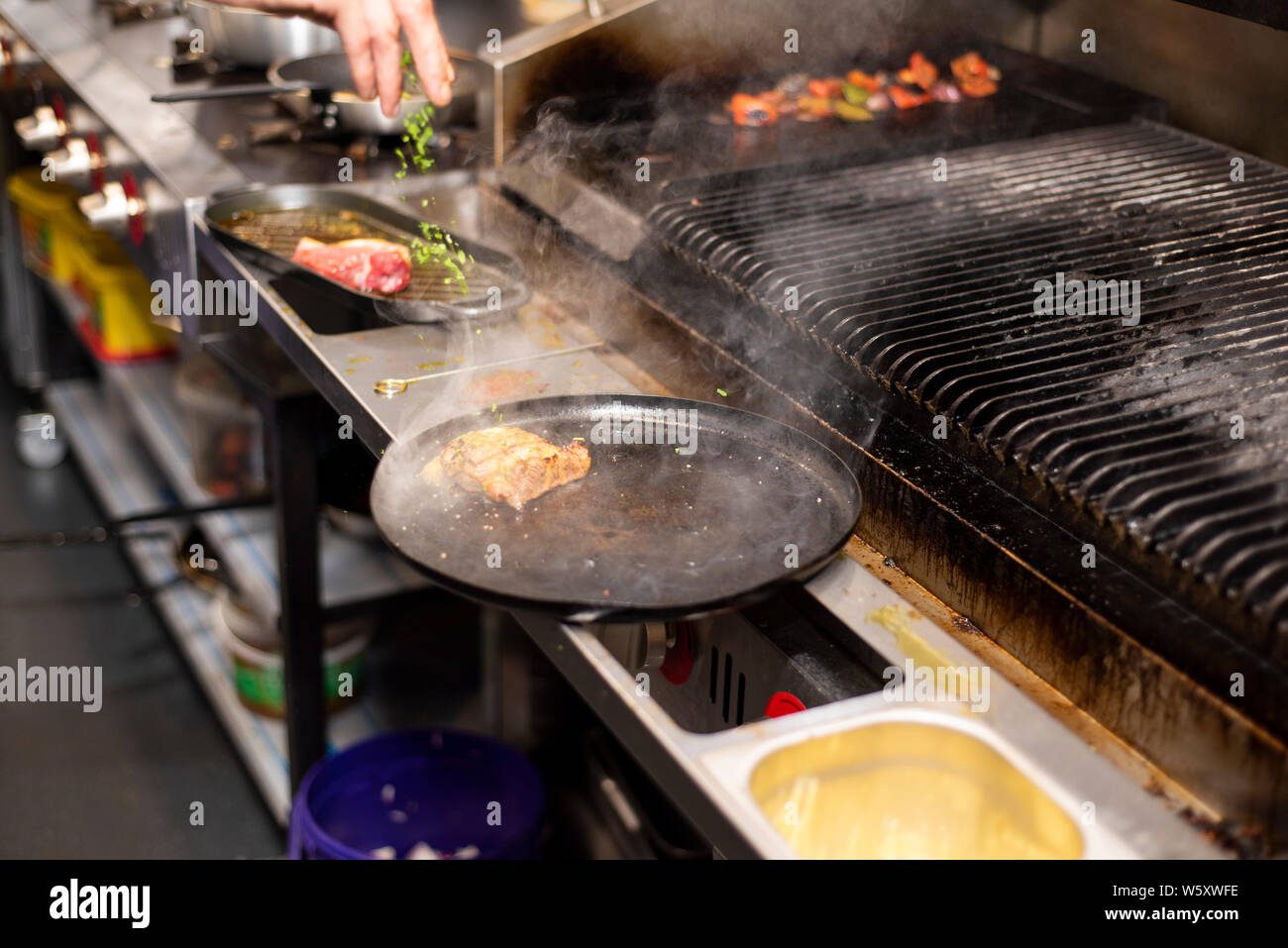 Doncaster, UK - May 11 2019: Close up on a chef hard at work ...