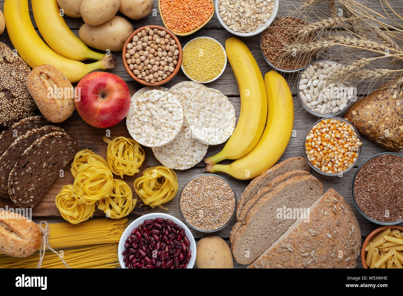Rich on carbohydrates food with wholegrain bread and fruits Stock Photo