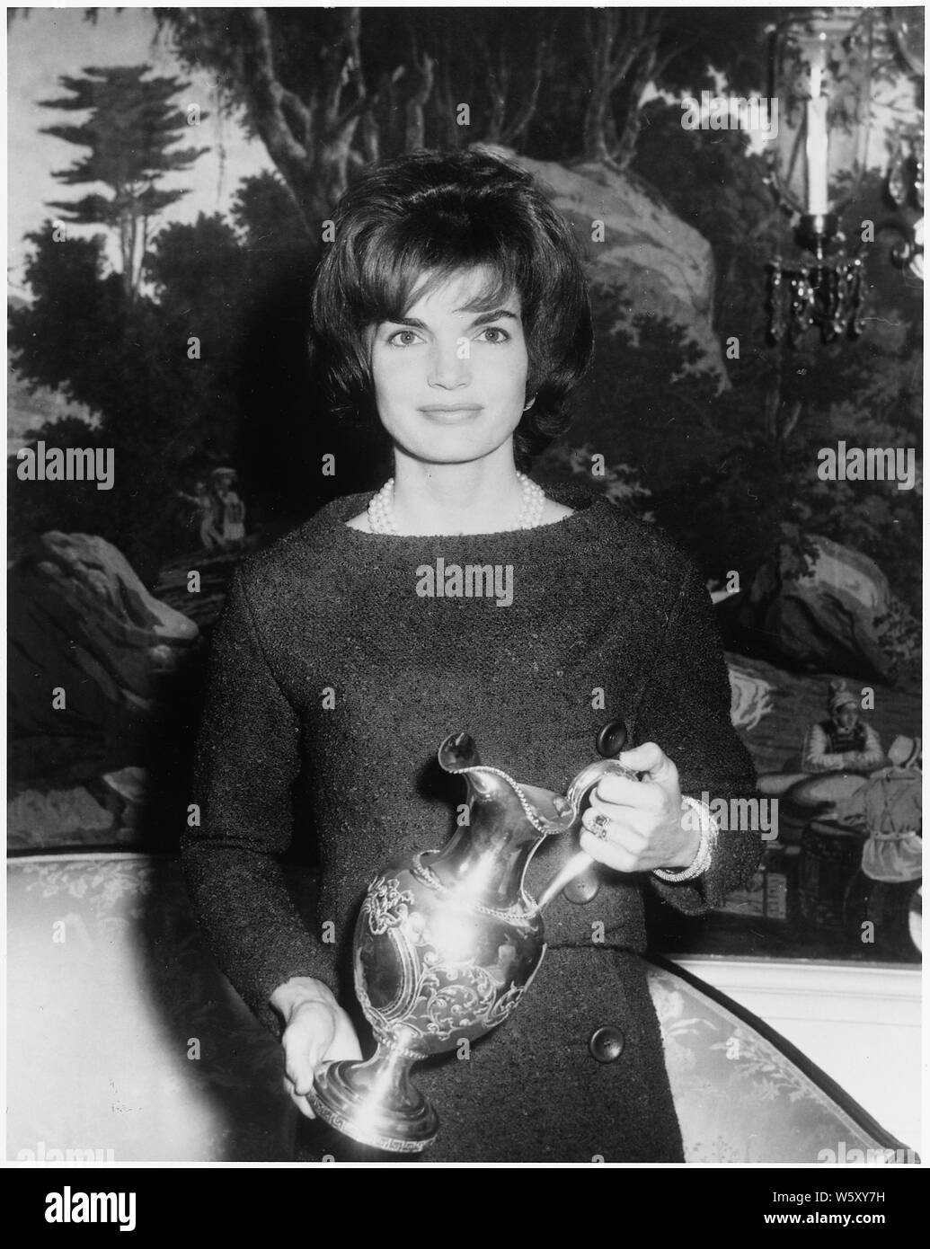 Silver Pitcher presented to White House. Mrs. Kennedy. White House, Diplomatic Reception Room. Stock Photo