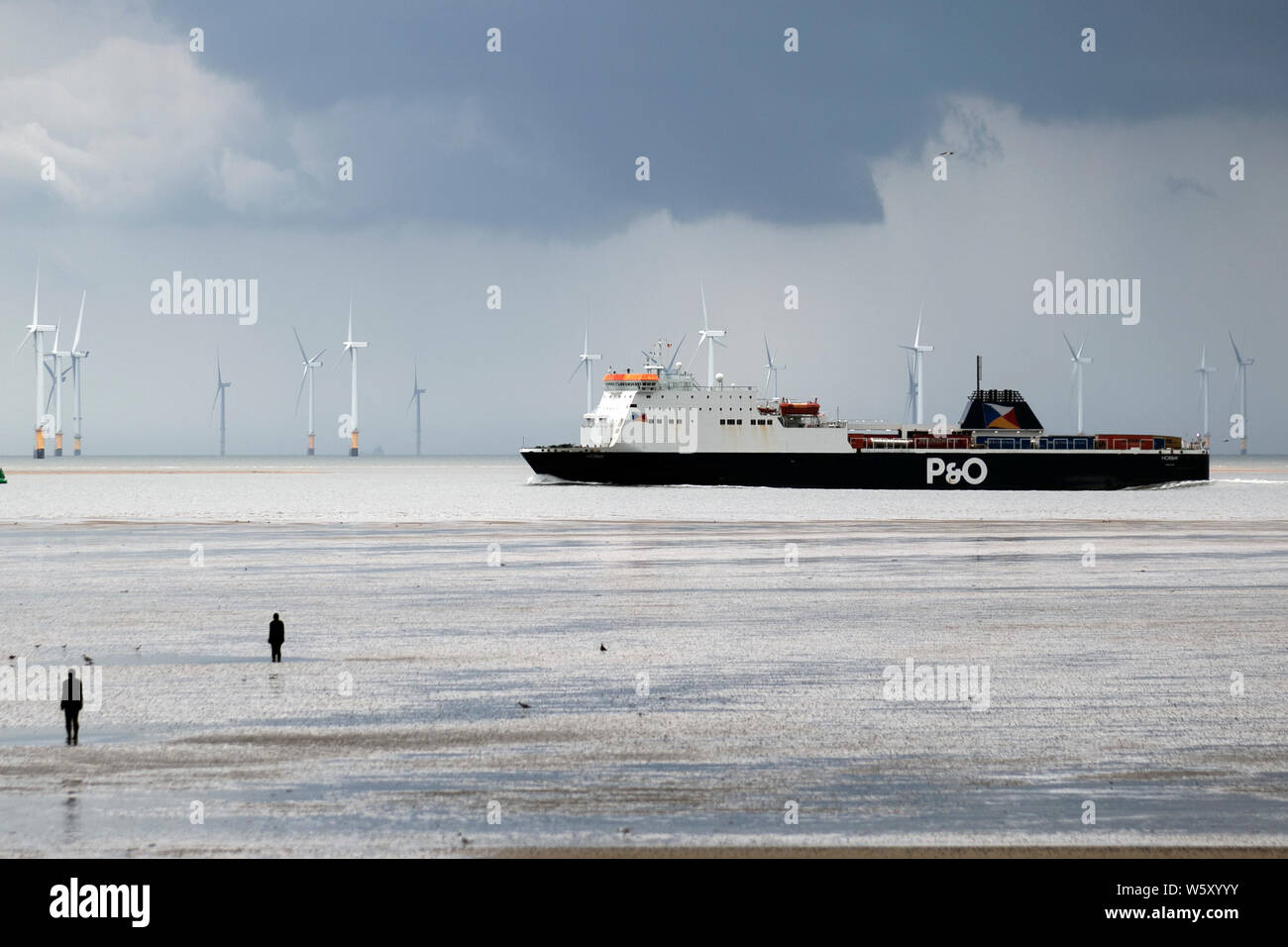 Crosby, Merseyside. 30th July 2019. UK Weather: Storm skies over Crosby Beach and the Irish sea. Credit; Credit: MediaWorldImages/Alamy Live News Stock Photo