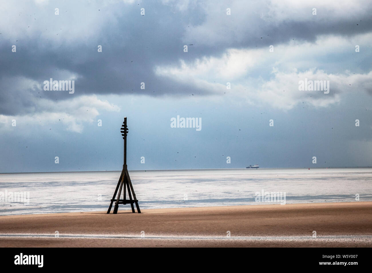 Crosby, Merseyside. 30th July 2019. UK Weather: Storm skies over Crosby Beach and the Irish sea. Credit; Credit: MediaWorldImages/Alamy Live News Stock Photo