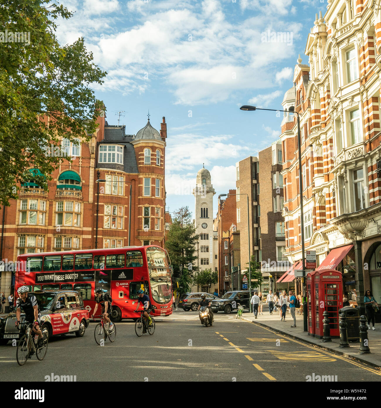 Sloane Square in the Chelsea area of London.The tower of Cadogan Hall (Concert Hall) is in the background. Stock Photo