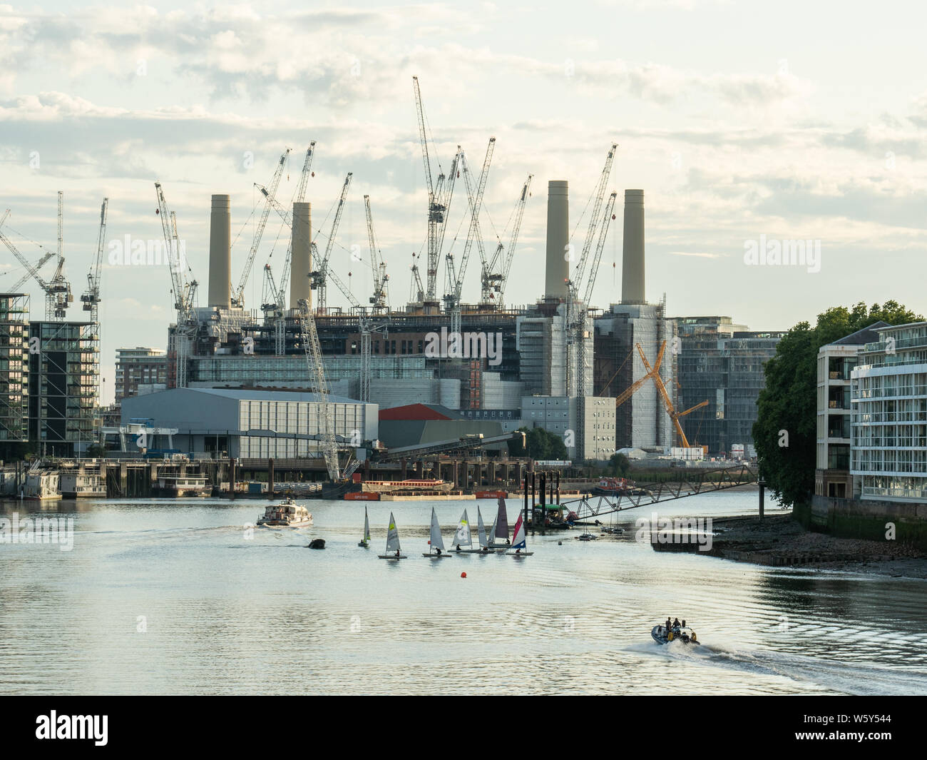 Sailing boats on the River Thames with the decommissioned Battersea Power Station on the south bank behind, Battersea, London. Stock Photo