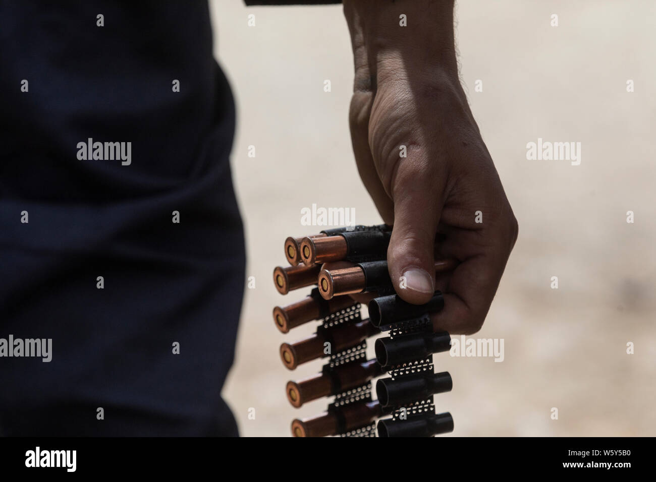 A man carries bullets for heavy machine guns Stock Photo