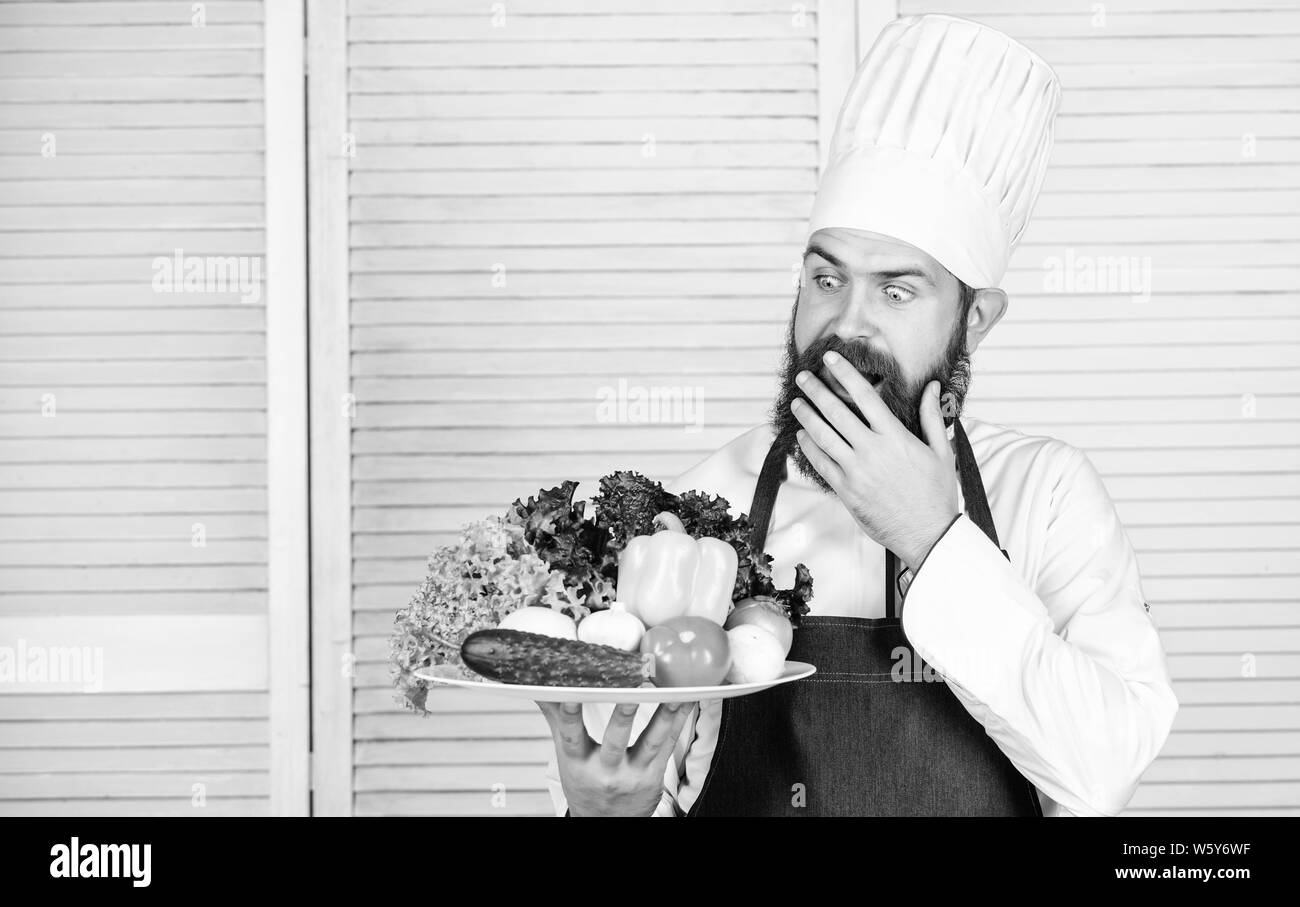 Dieting organic food. Cuisine culinary. Vitamin. Healthy food cooking. Mature hipster with beard. Sales assistant. serious bearded man. chef recipe. Vegetarian salad with fresh vegetables. Stock Photo