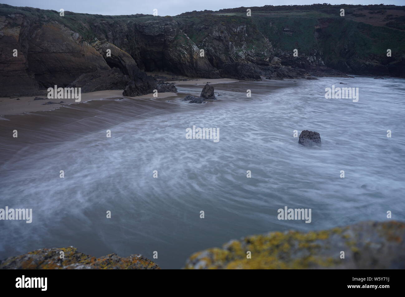 A Photo Of Goat Island In Ardmore Ireland Showing The Moving Water And The Cliffs Stock Photo Alamy