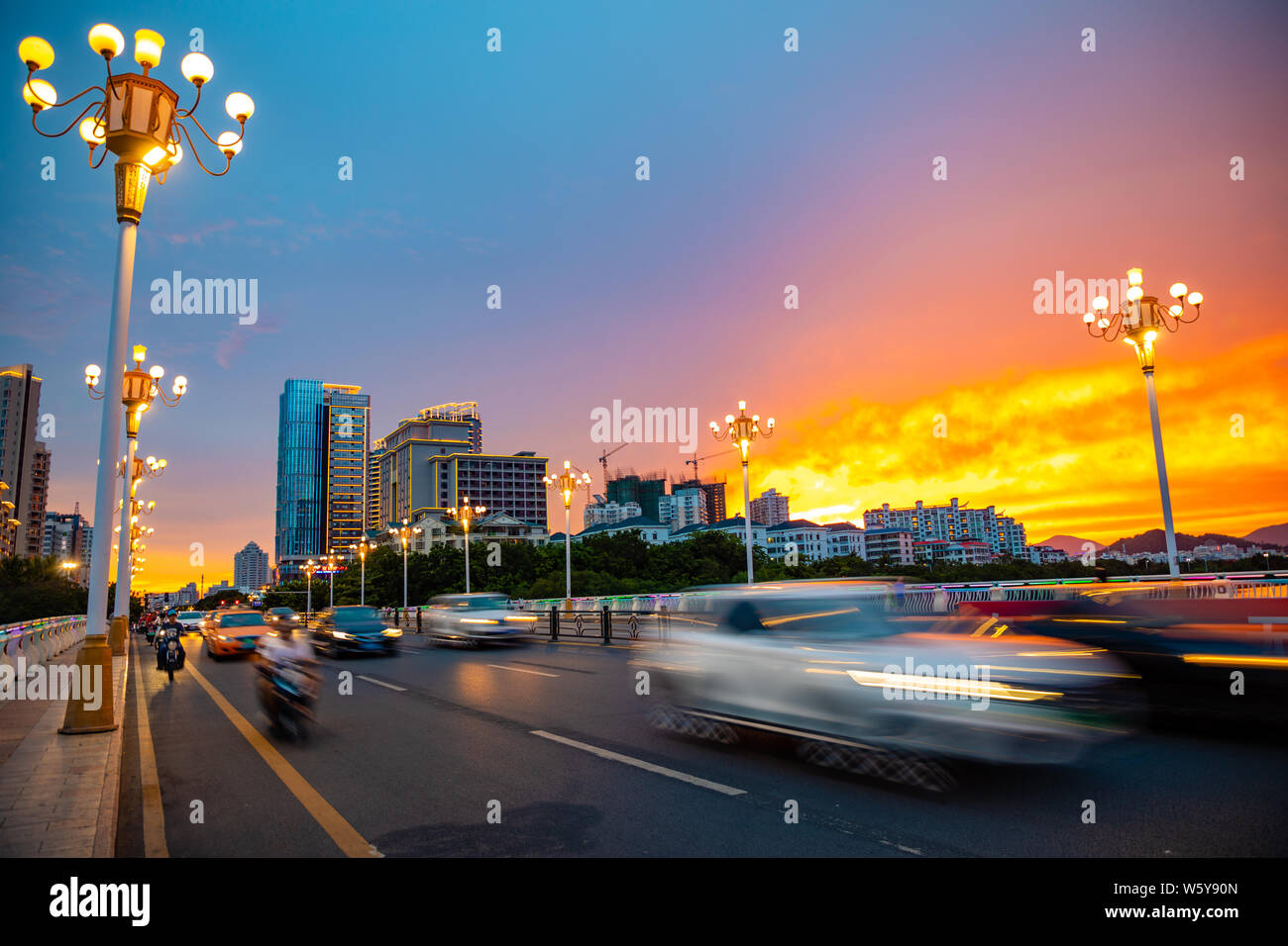 Sanya, Hainan, China - 26.06.2019: Sanya Cityscape with busy road and  Buildings in the sunset time, Hainan Province, China Stock Photo - Alamy