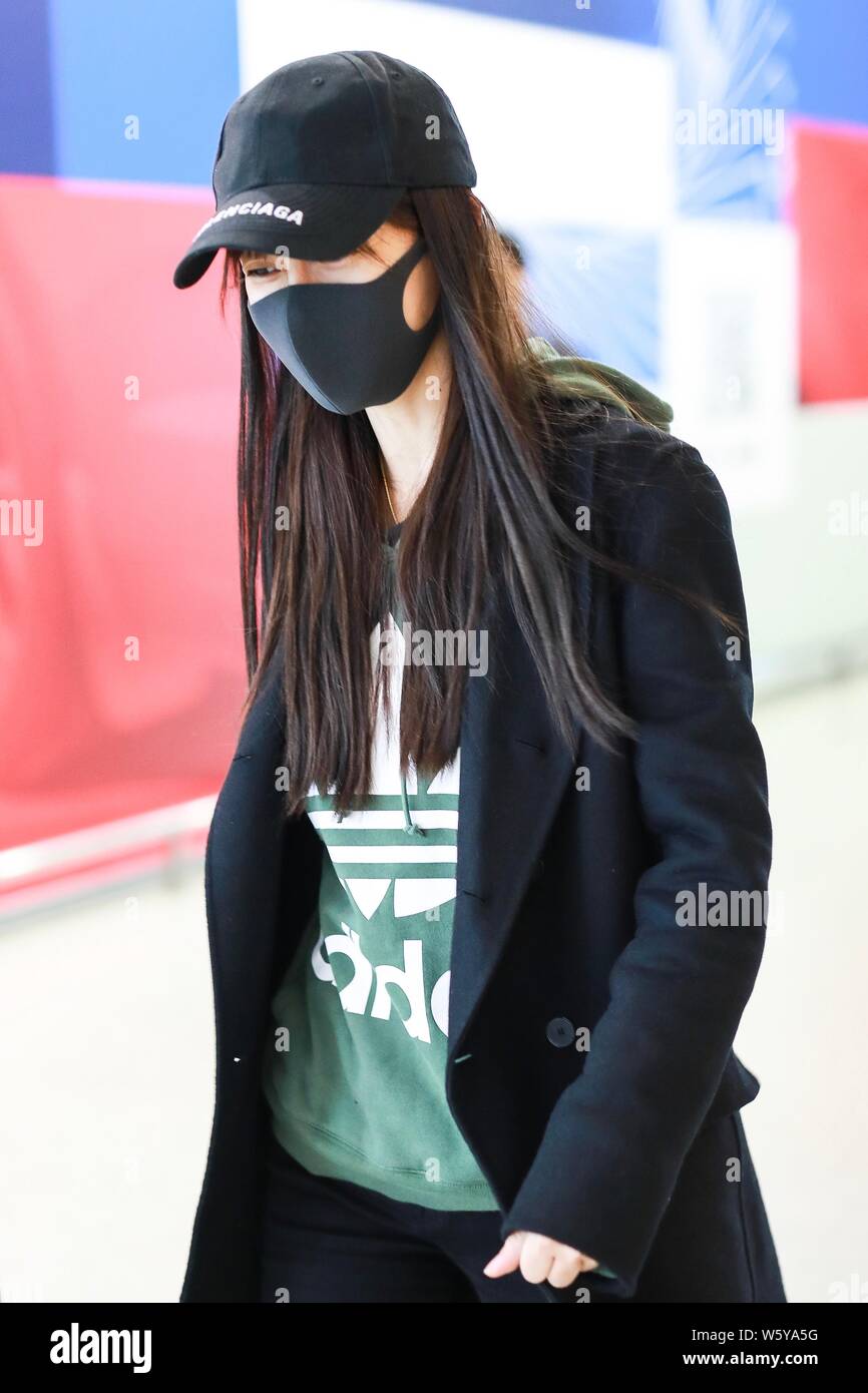 Hong Kong actress Angelababy arrives at an in Shanghai, 9 2018. Hat: Balenciaga Hoodie: adidas Shoes: Golden goose Trouse Stock Photo - Alamy