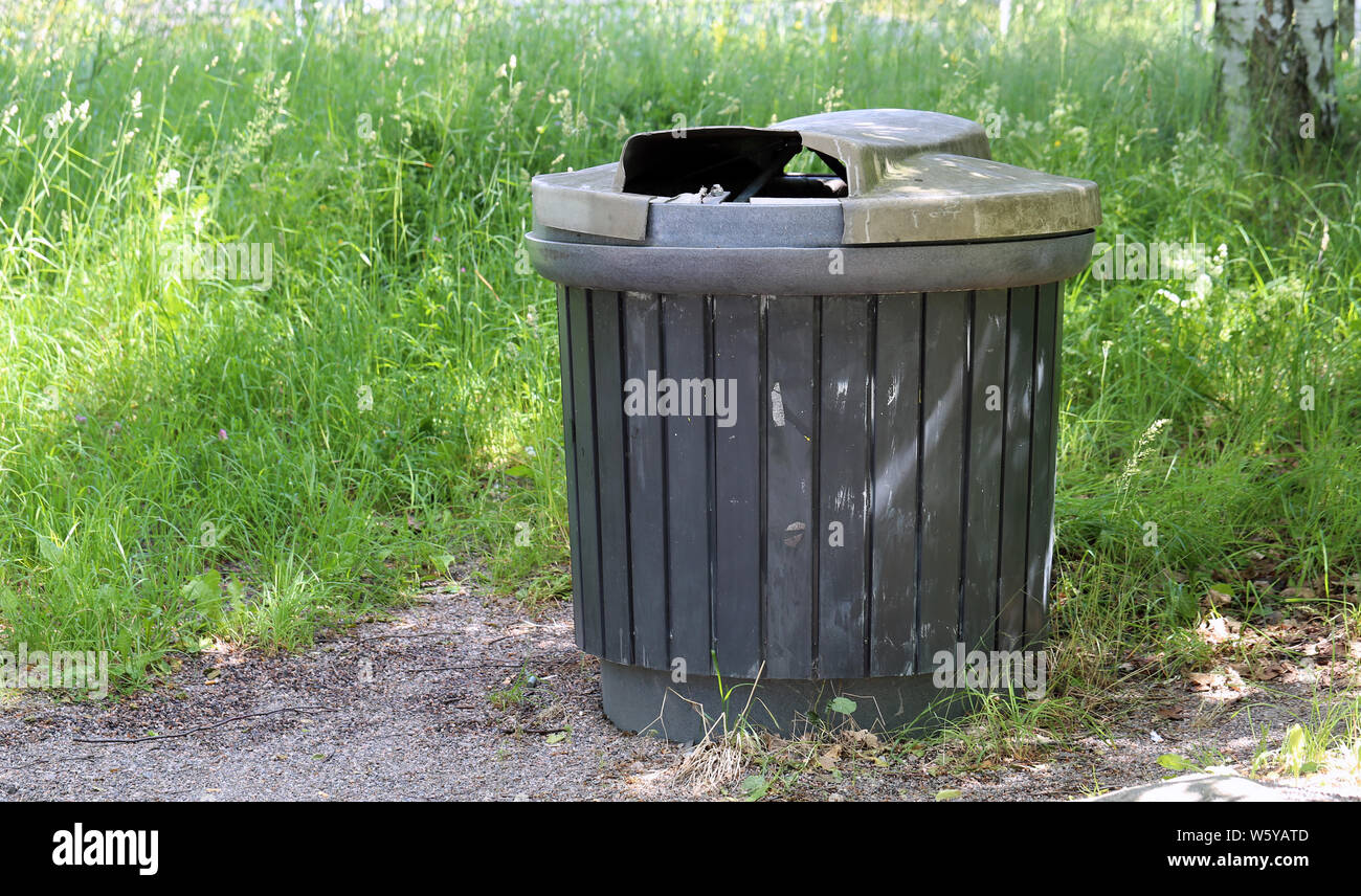 https://c8.alamy.com/comp/W5YATD/relatively-big-black-public-garbage-can-photographed-during-a-sunny-summer-day-in-helsinki-finland-in-this-photo-you-can-see-the-garbage-pin-W5YATD.jpg