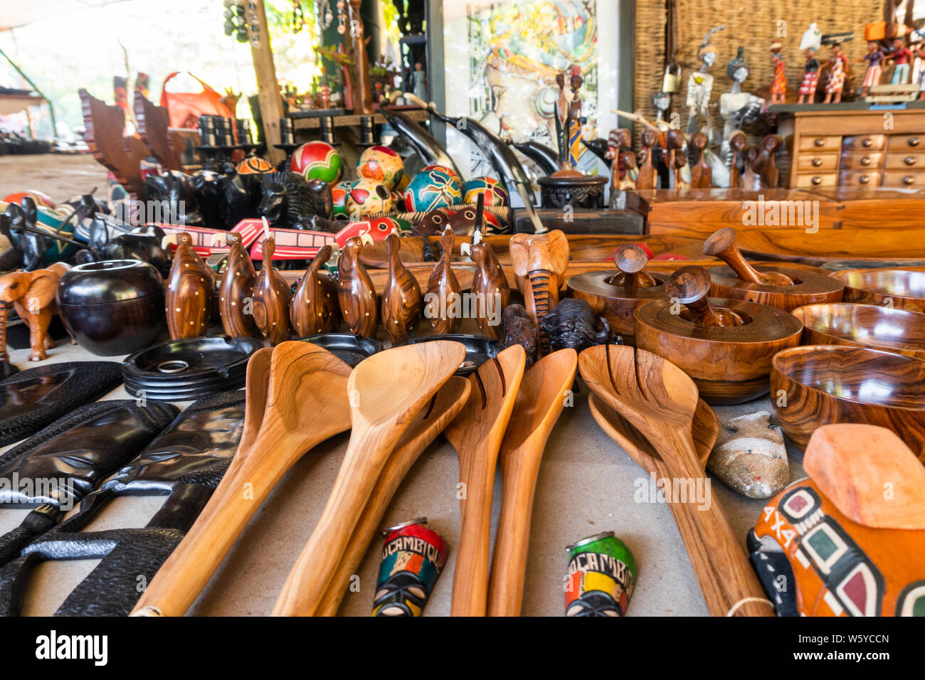 Wooden spoons and more souvenirs on traditional african market of FEIMA
