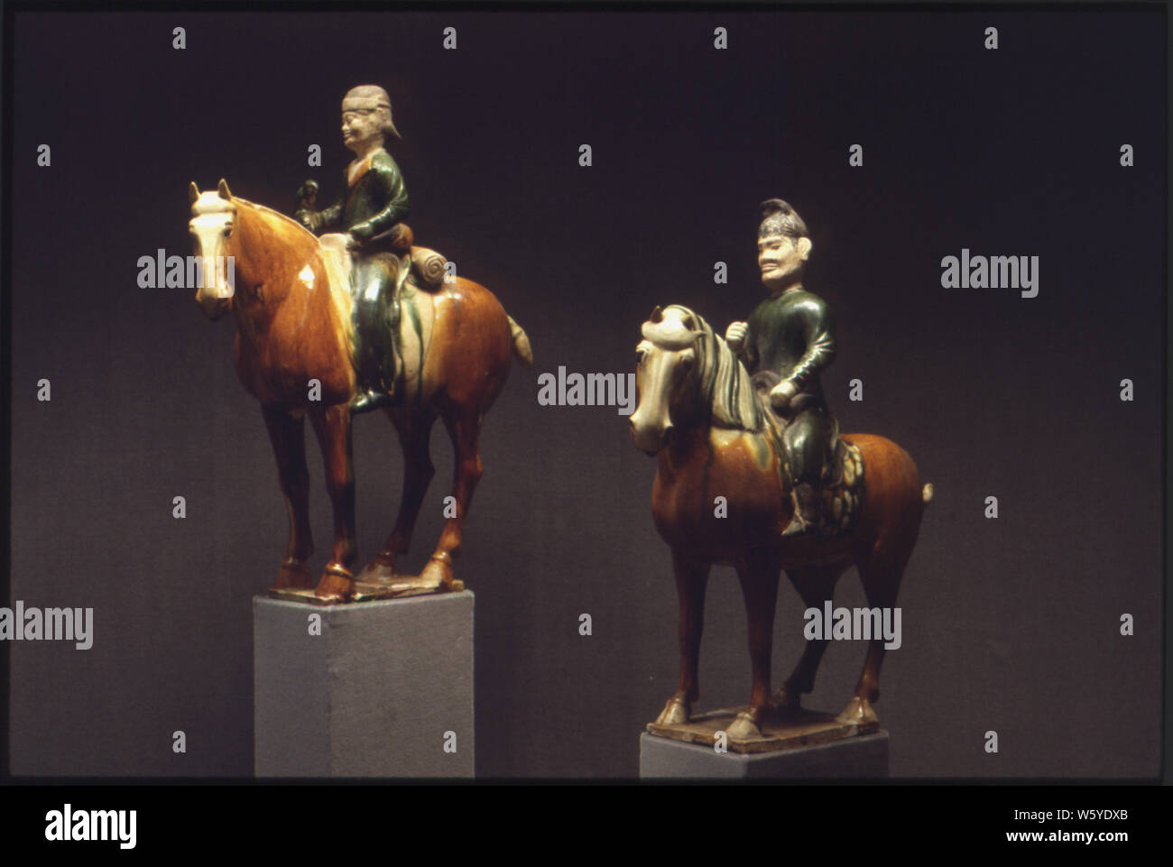 Two terra cotta tomb sculptures of men on horses; Scope and content:  Each figure is made of glazed and unglazed terra cotta. They were excavated near Sian, capital of Shensi Province and given to President and Mrs. Lyndon B. Johnson from President and Madame Chiang Kai-Shek of the Republic of China. The artist is unknown. General notes:  From left to right, the first figure measures 16 x 13-3/4 x 4; the second measures 16-1/2 x 14-3/4 x 4-1/4. Stock Photo