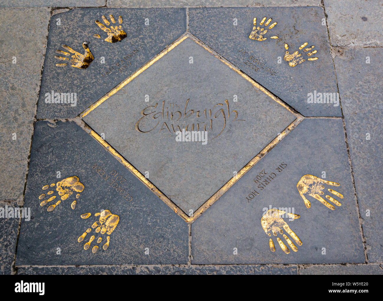 Paving slab hand prints by JK Rowling, Sir Chris Hoy, George Kerr & Ian Rankin, City Chambers, Royal Mile, Edinburgh, Scotland Stock Photo