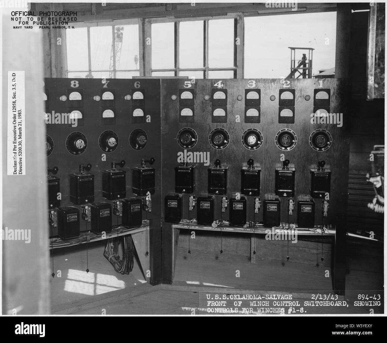 USS Oklahoma- Salvage, 2/13/43; 894-43; Front of winch control switchboard, showing controls for winches 1-8; Scope and content:  This is one of a collection of photographs of salvage operations at Pearl Harbor Naval Shipyard taken by the shipyard during the period following the Japanese attack on Pearl Harbor which initiated US participation in World War II. The photographs are found in a number of files in several shipyard records series. Stock Photo