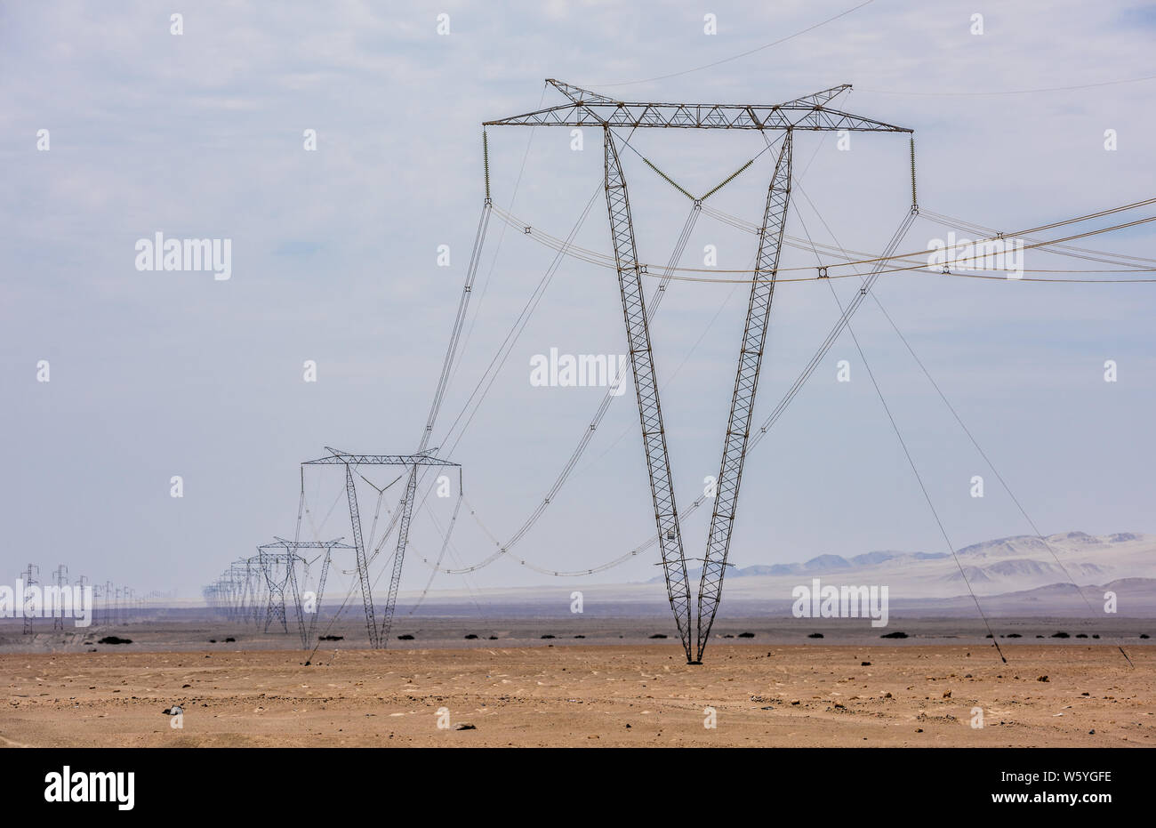 High voltage lines and power pylons Stock Photo - Alamy