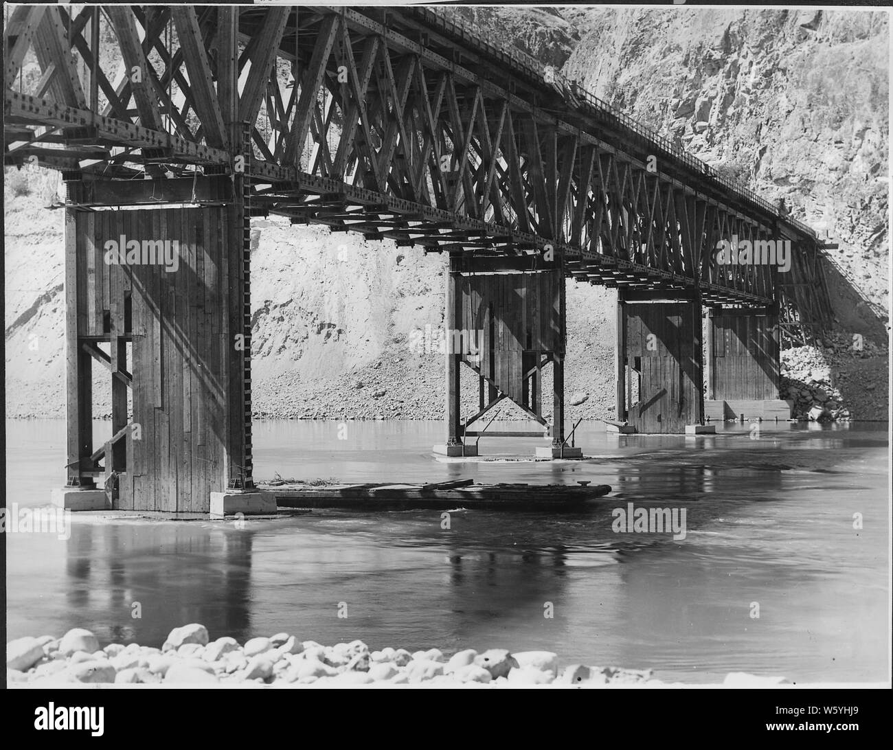 View shows pier skirting stripped during high water 1935.; Scope and content:  Photograph from Volume Two of a series of photo albums documenting the construction of the Grand Coulee Dam and related work on the Columbia Basin Project. Stock Photo