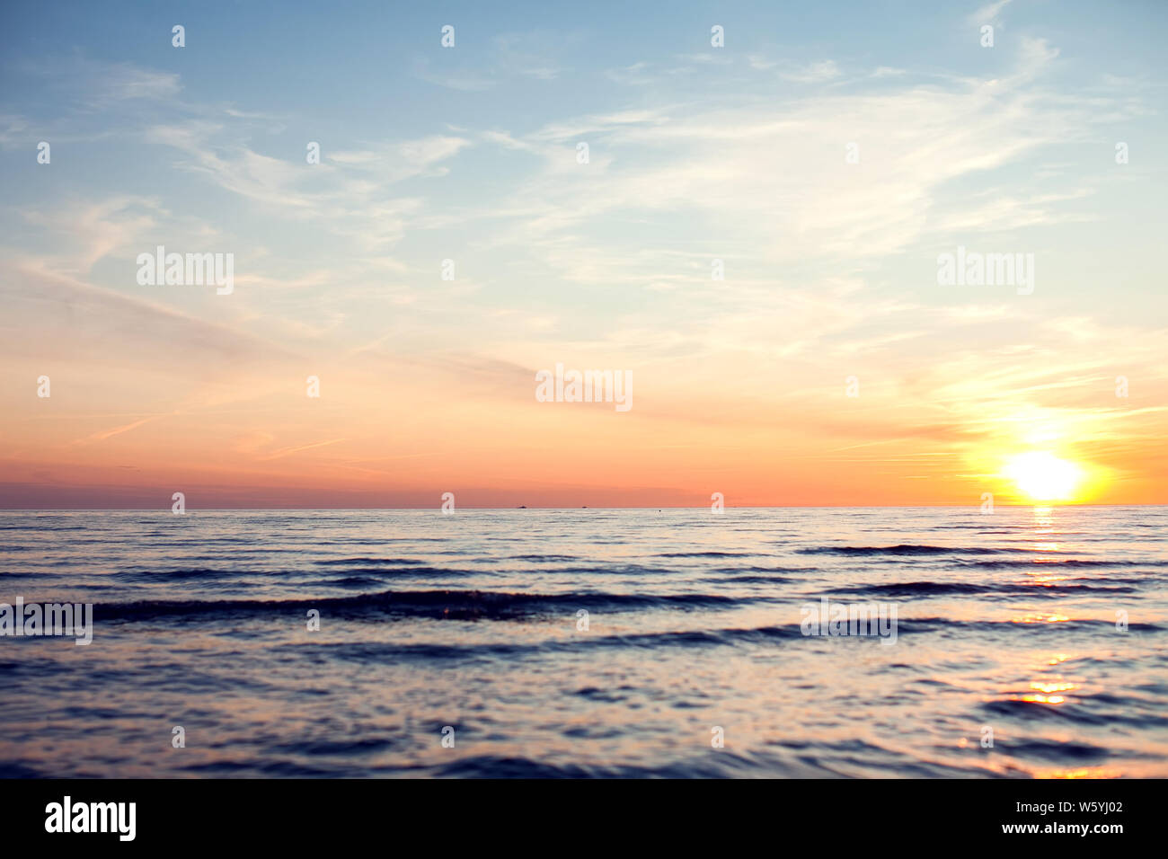 Sea and sky with clouds at sunset. Beach in the evening Stock Photo - Alamy