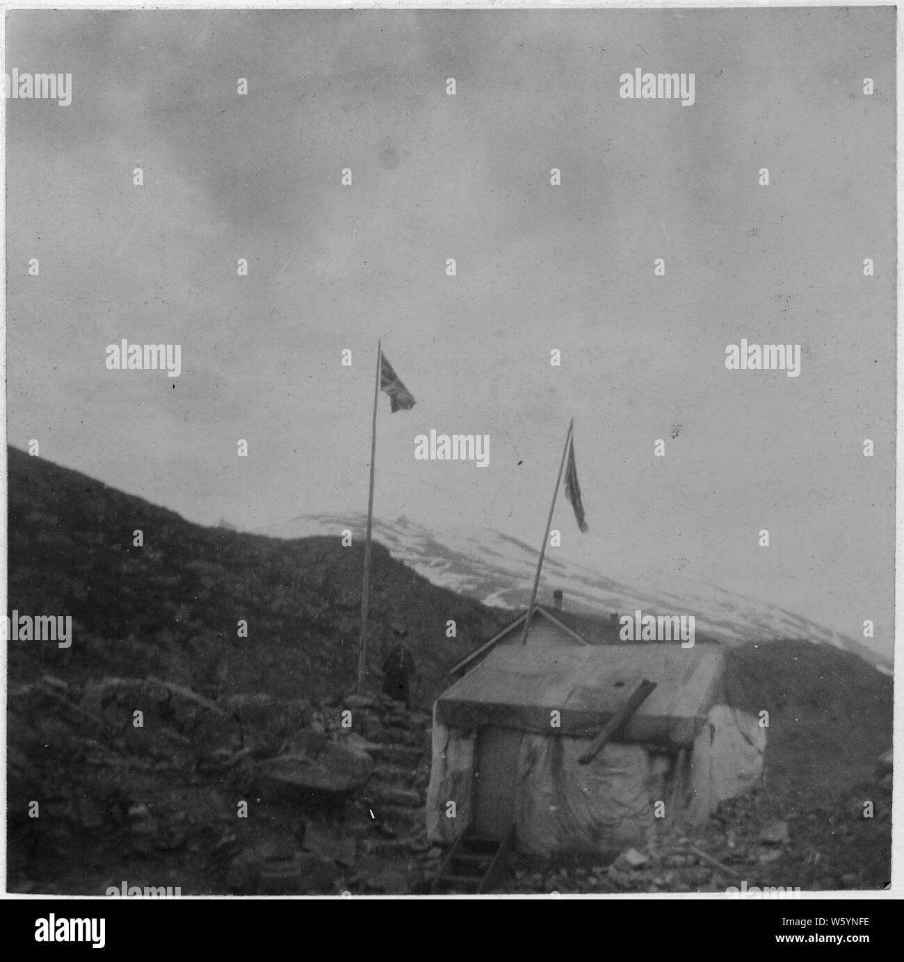 White Pass, Border Line. In Mountains, hut in foreground Stock Photo