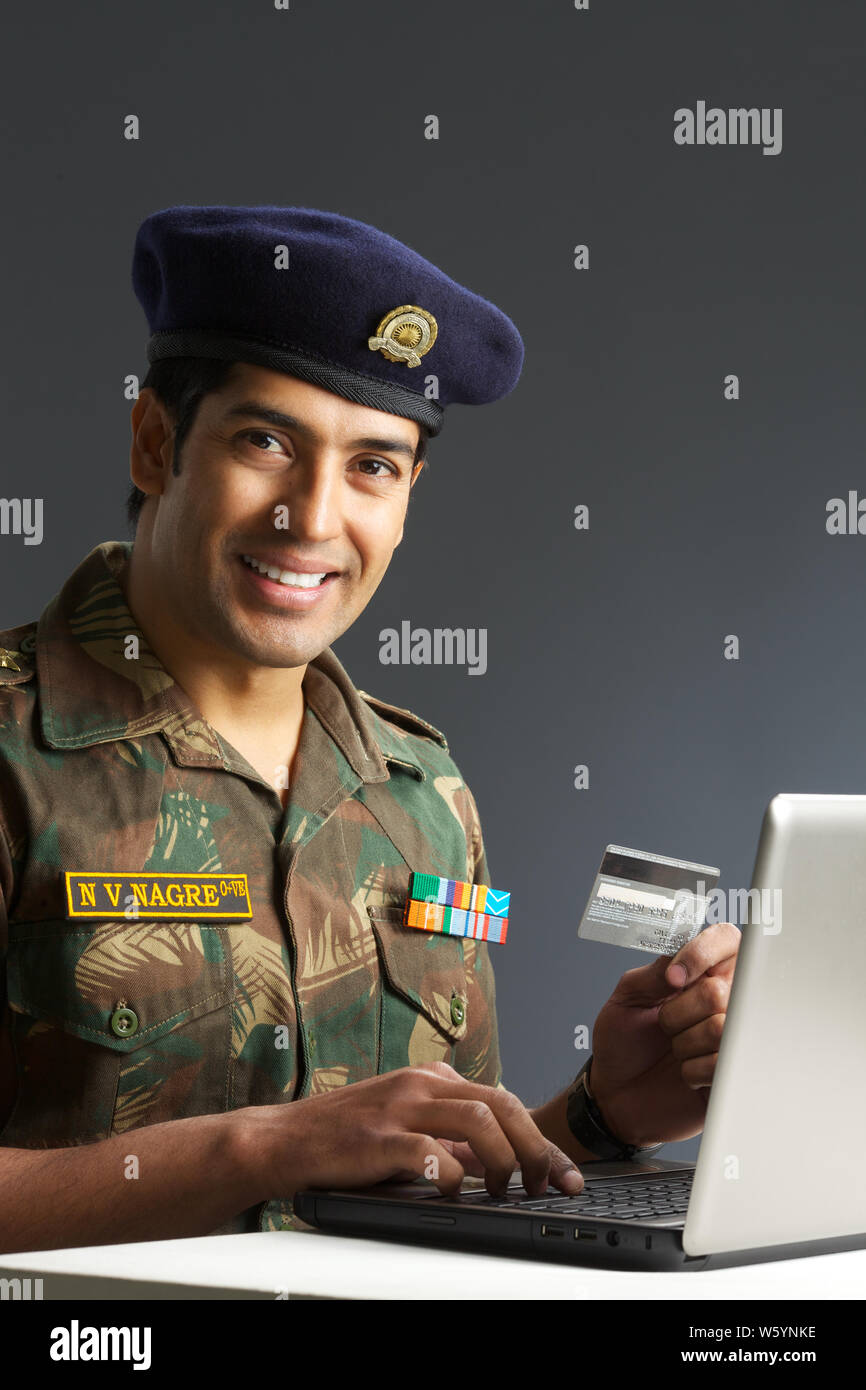 Army Soldier doing online shopping Stock Photo Alamy