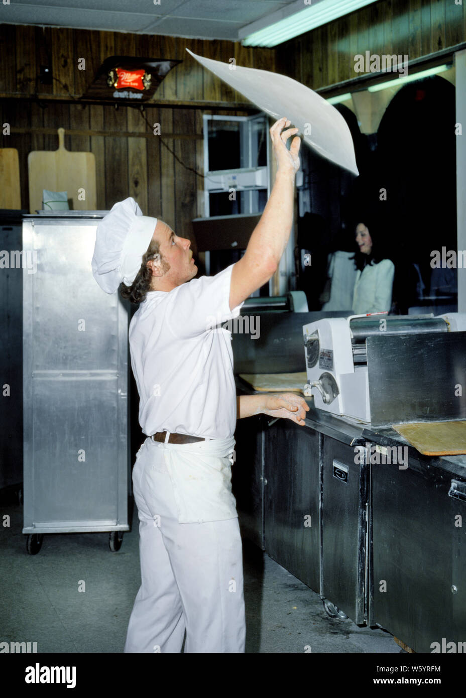 1970s MAN A PIZZA MAKER THROWING SPINNING TOSSING DOUGH INTO THE AIR